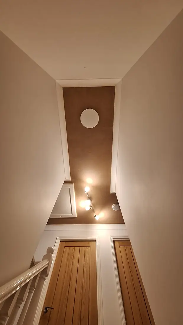 Landing and stairwell ceiling plastered